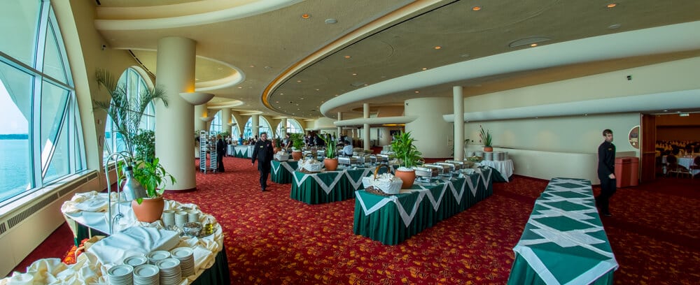 A view of Grand Terrace with buffet serving tables and staff members