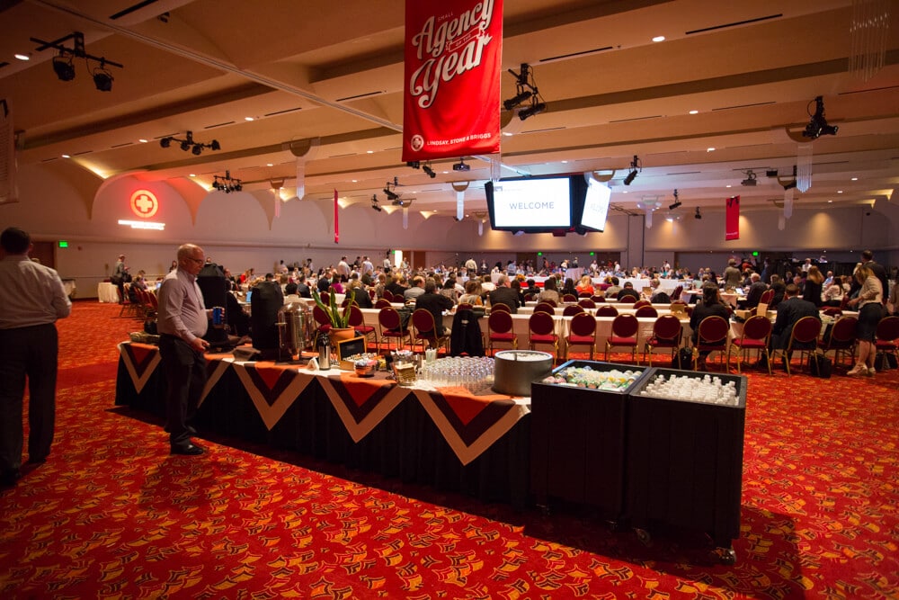 Madison Ballroom with people during an event, with a drink buffet and meeting tables