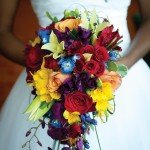 woman is holding a bouquet of flowers