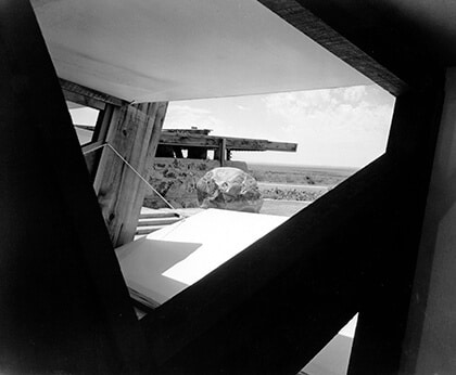 A black-and-white view of Taliesin West with canvas flaps designed by Wright.