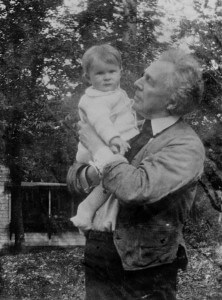 Frank Lloyd Wright holding a child photo