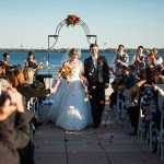 just married couple standing in front of a crowd