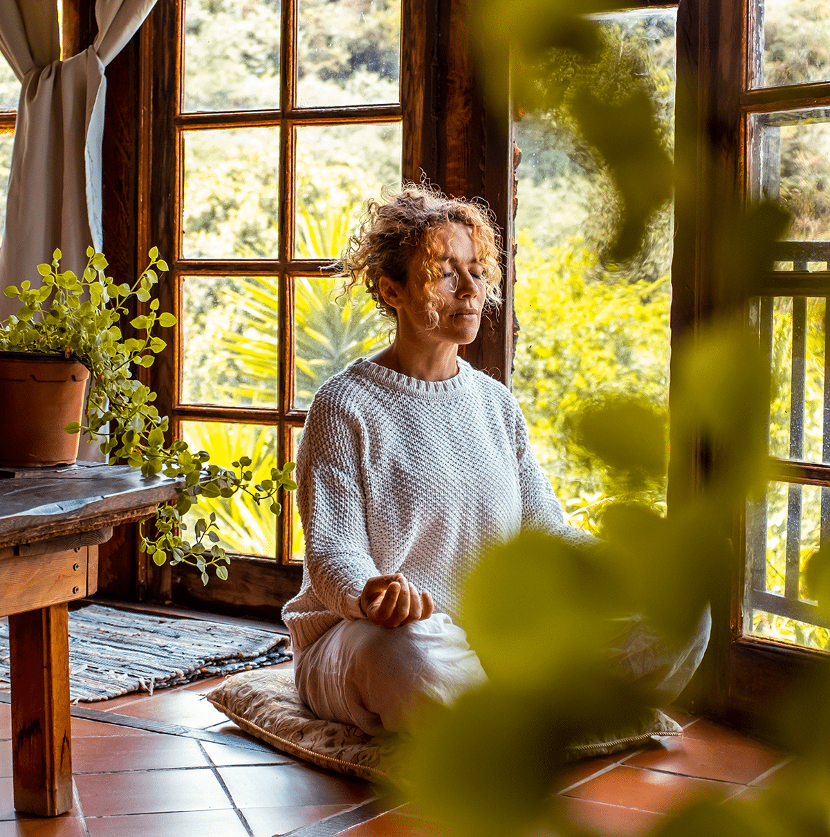 woman meditating at home