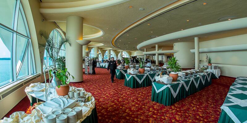 A view of Grand Terrace with buffet serving tables and staff members
