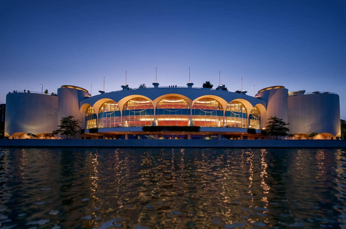 An artistic view of Monona Terrace from the lake at night