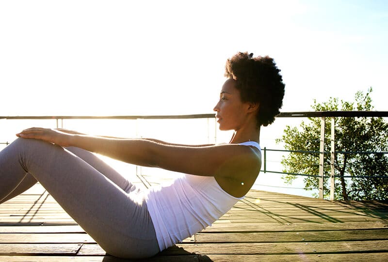 Healthy young woman doing abs crunches