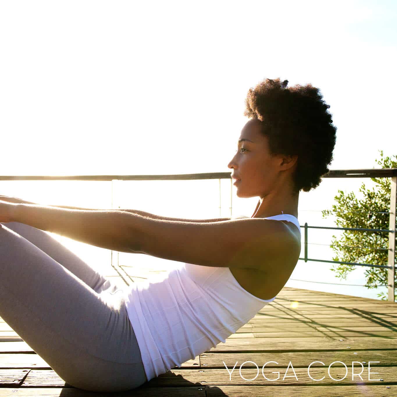 Woman doing yoga in a sunny terrace