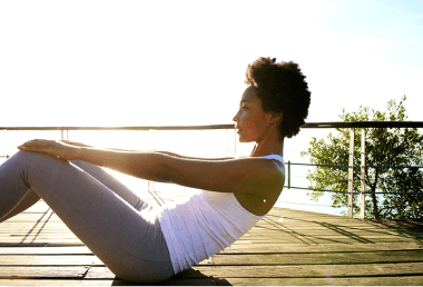 Woman doing yoga in a terrace