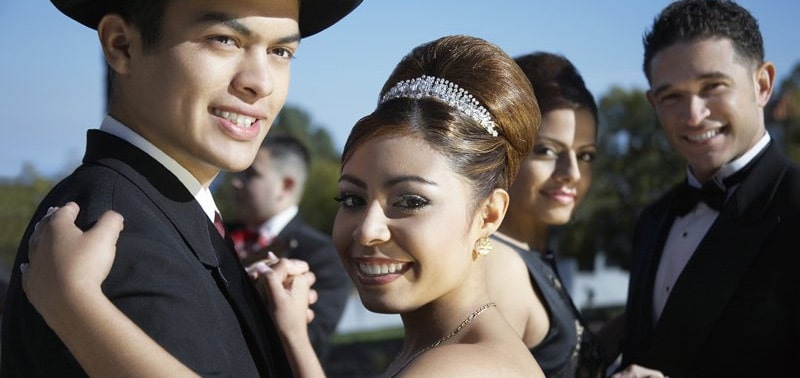 Two couples dancing at a quinceanera party